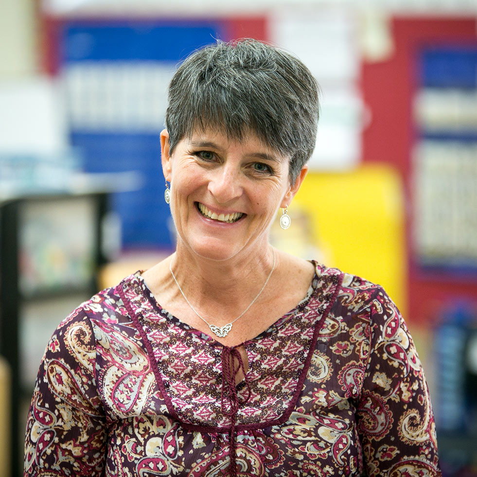 Teacher smiling in a classroom